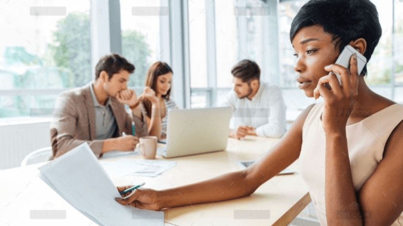 demo-attachment-2303-serious-businesswoman-with-documents-talking-on-P9Q6LX6@2x