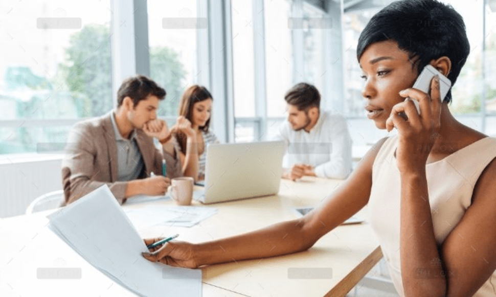 demo-attachment-2303-serious-businesswoman-with-documents-talking-on-P9Q6LX6@2x